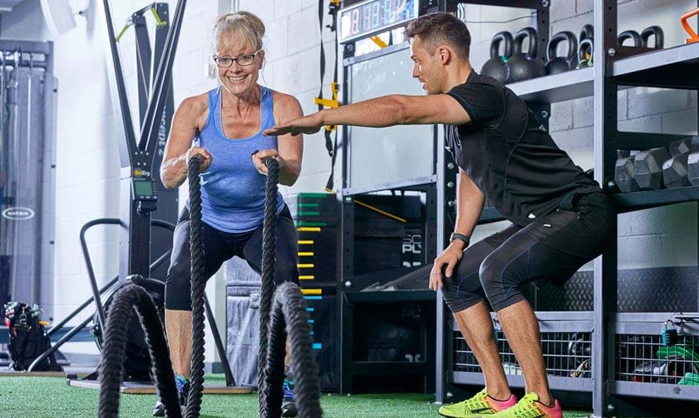 personal training int eh gym old woman